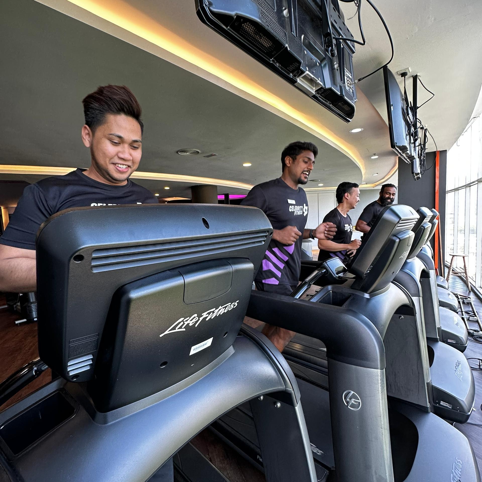 Trainer running on treadmill.